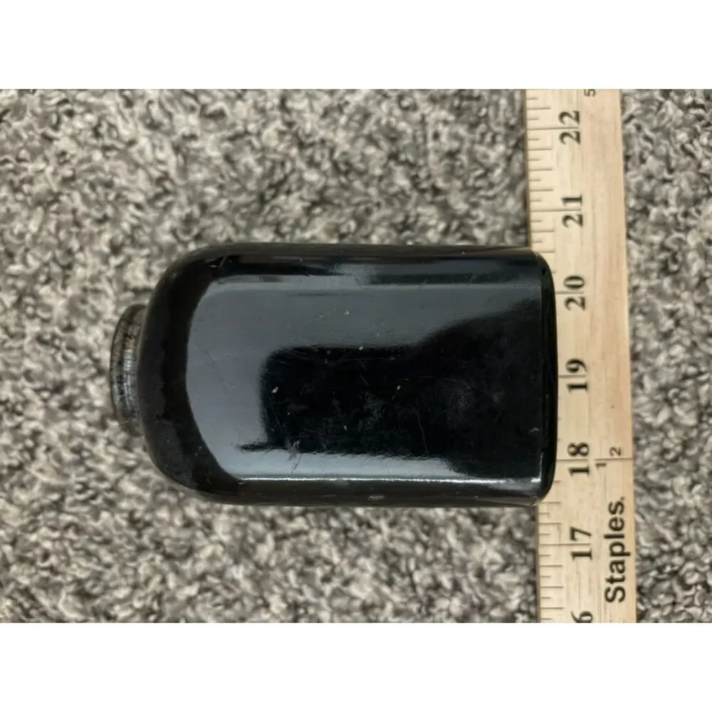 Vtg. glass medicine bottle - amber in light